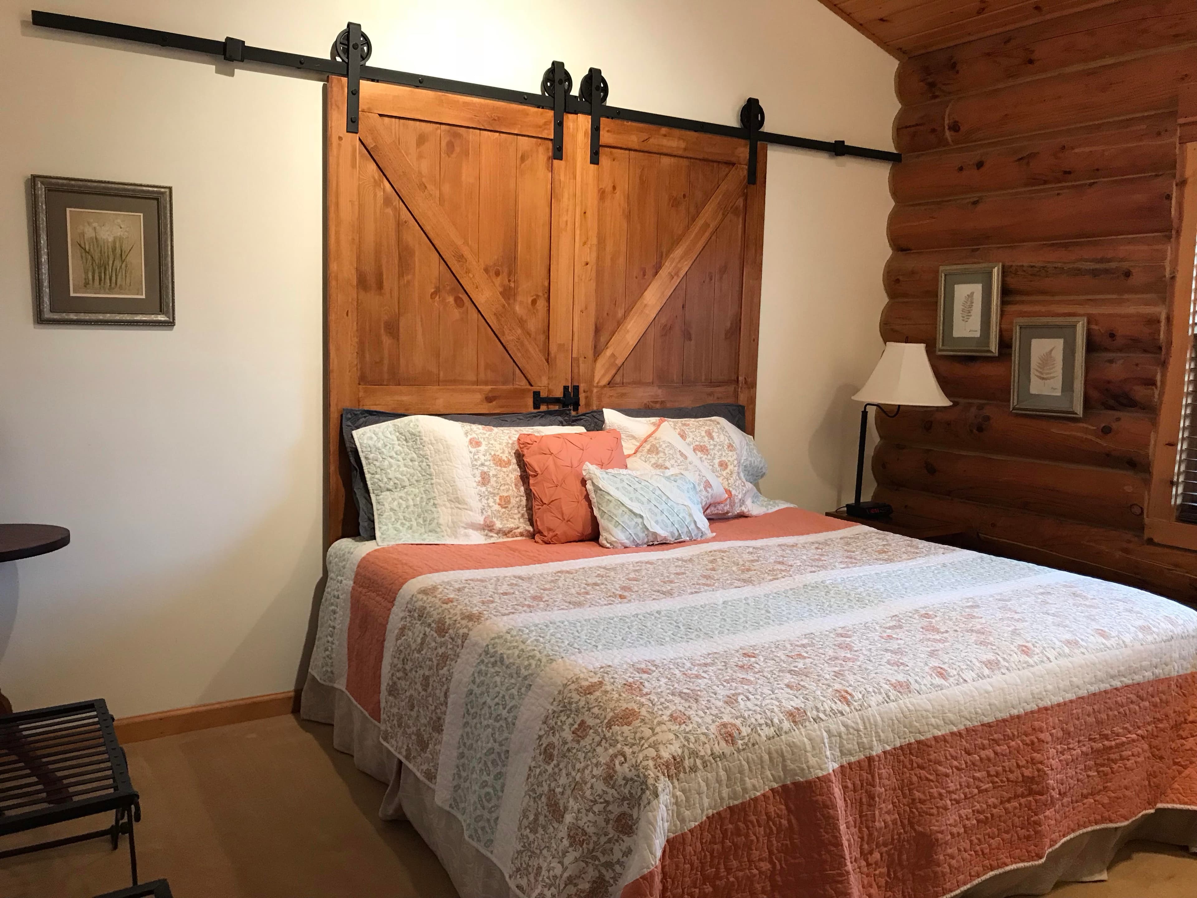 King sized setup, with Barnwood doors pushed together to form large headboard.
