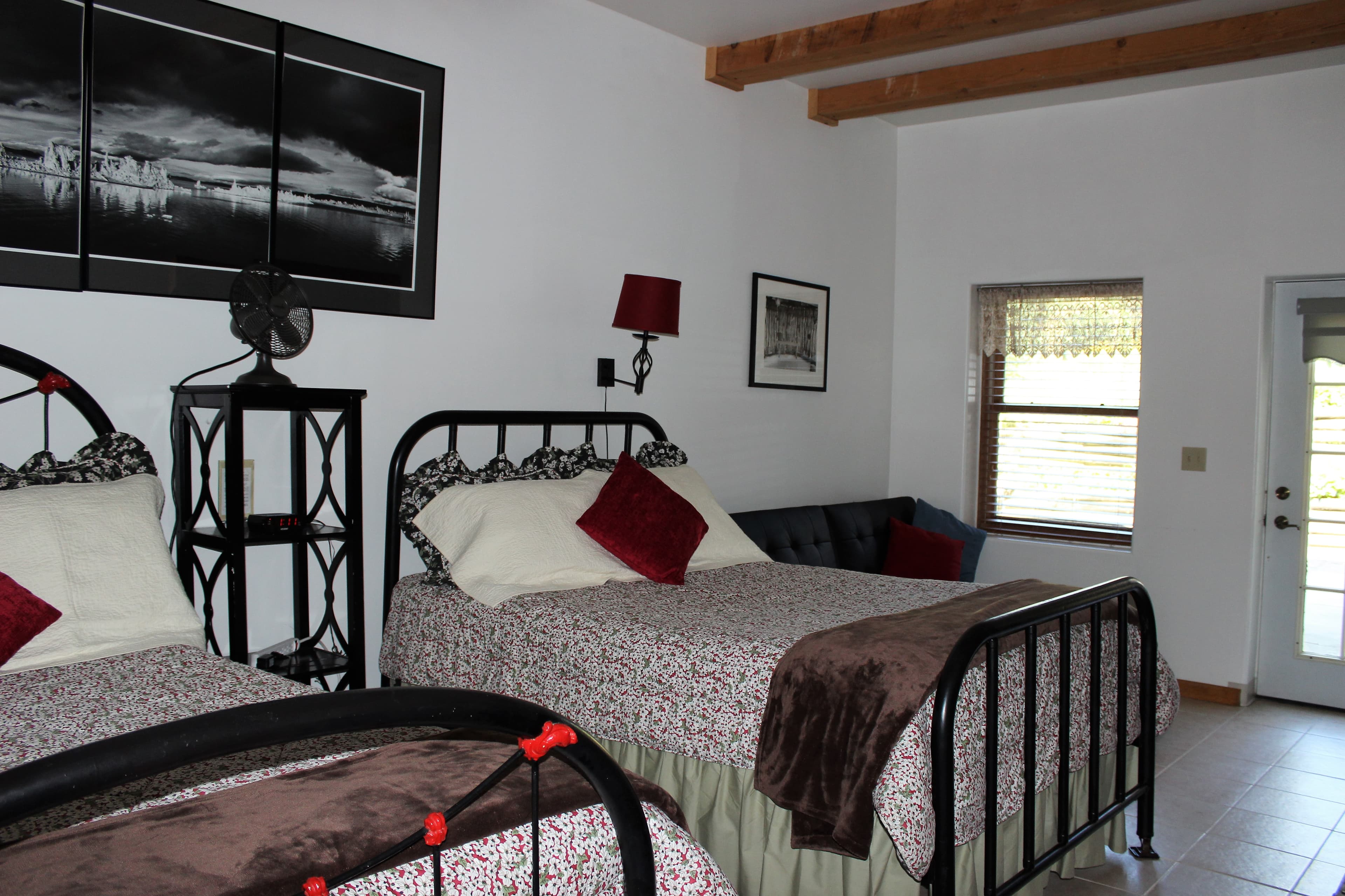 Lower level room is cool and comfortable with a black, white and red theme.