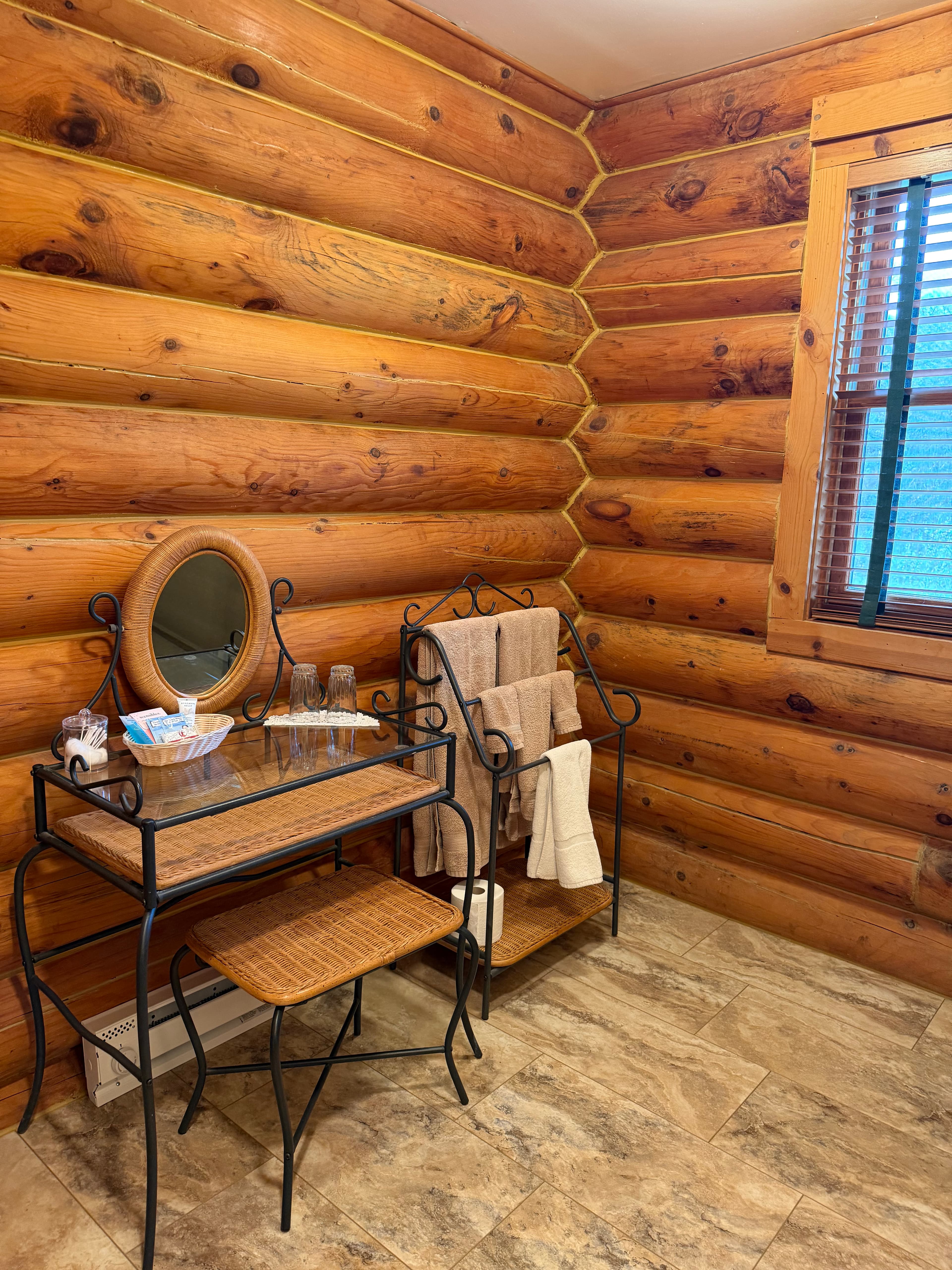 Large bathroom with walk in shower and wicker vanity with mirror